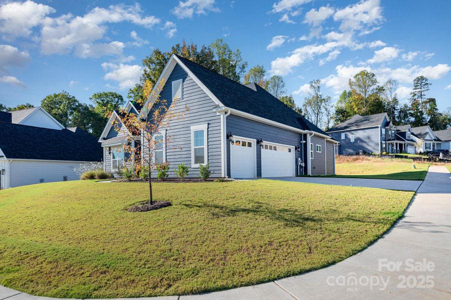 Spacious 3-car garage with plenty of driveway parking.