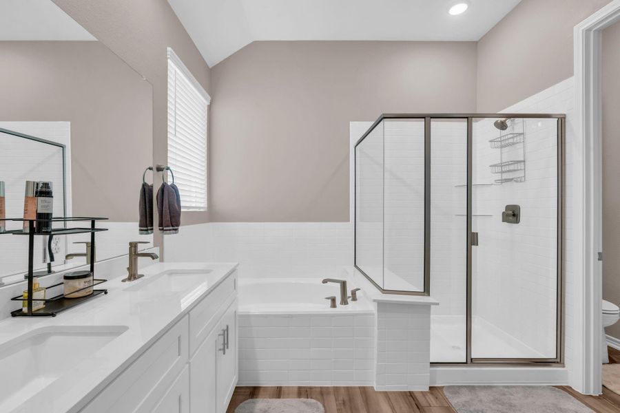 Primary bath and adjoining water closet. Primary bath and adjoining water closet.