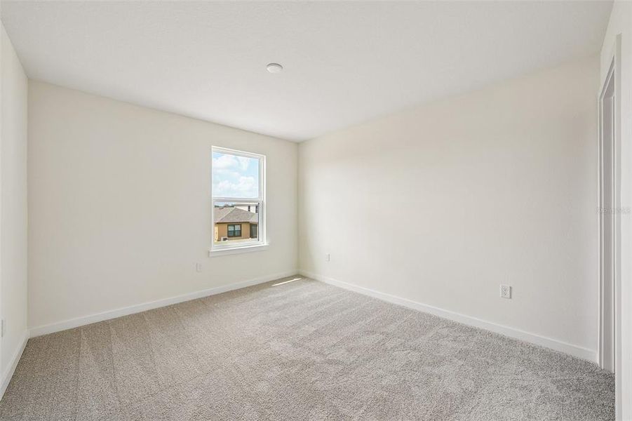 Spacious, unfurnished interior of a new home in Grasslands West, Lakeland (Image 38).
