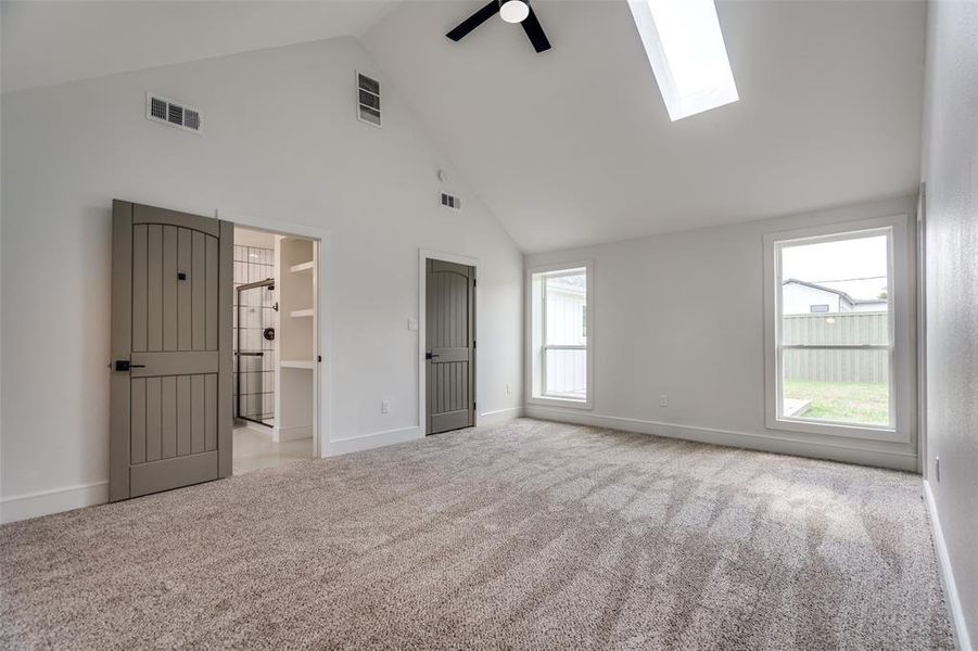 Oversized primary bedroom facing the back yard, the back deck and the eight foot privacy fence.  What a wonderful place to call it a night.