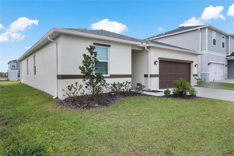 Front exterior of a new home in , Davenport, FL, highlighting curb appeal (Image 20).