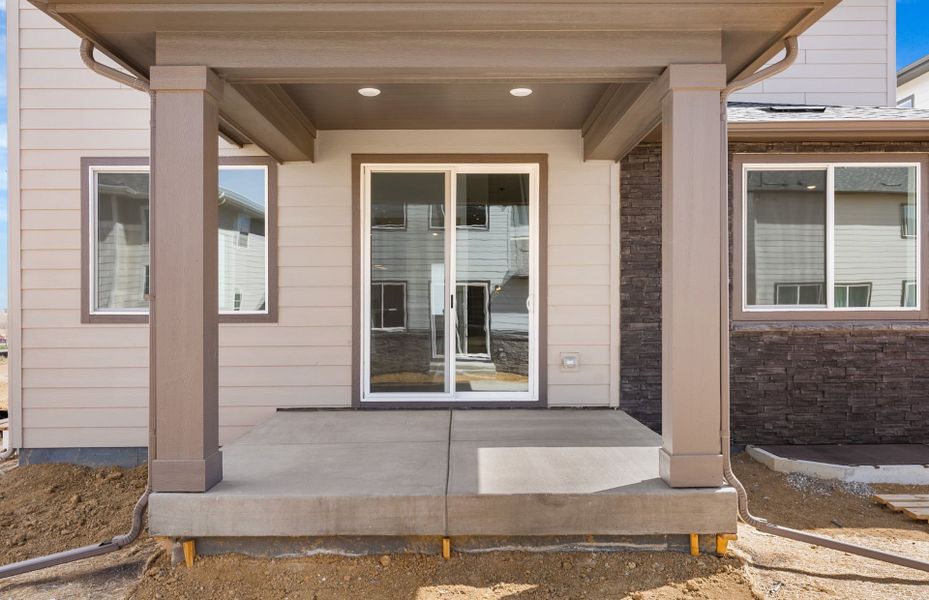Exterior details and patio area of a home in Harvest Crossing, Aurora (Image 3).