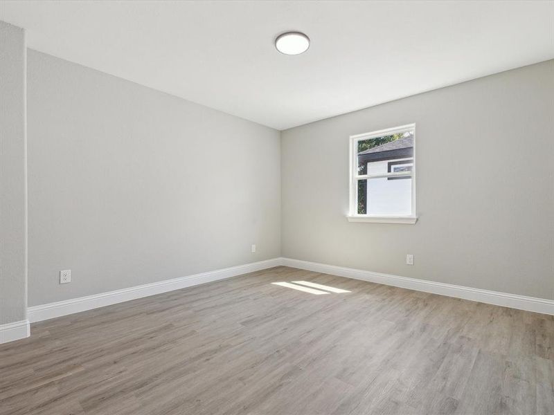 Spare room with light wood-type flooring