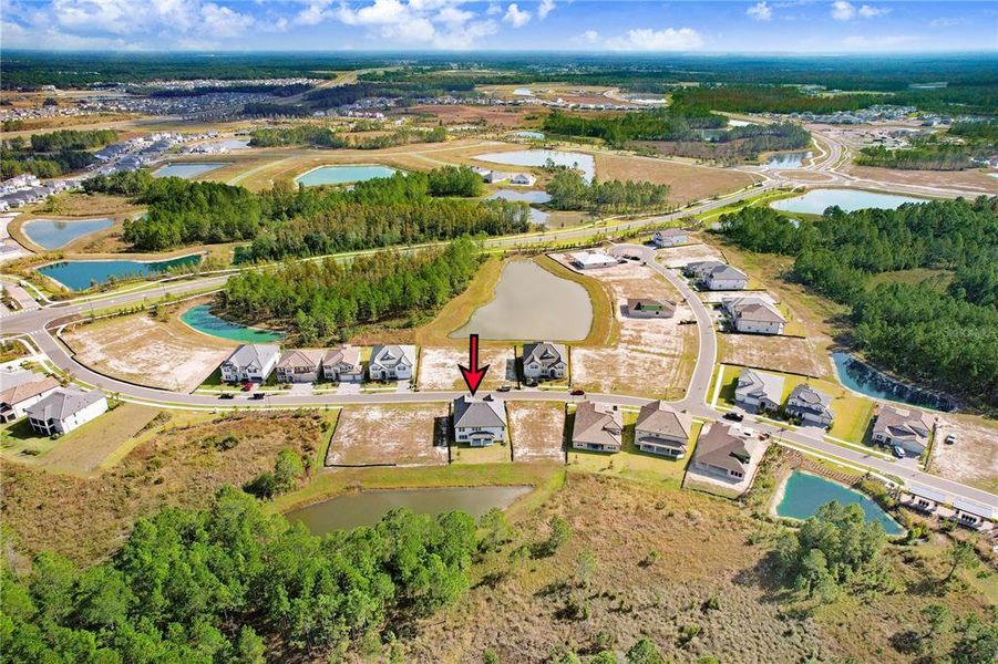 Front exterior of a new home in Shortgrass at Two Rivers, Zephyrhills, FL, highlighting curb appeal (Image 35). Front exterior of a new home in Shortgrass at Two Rivers, Zephyrhills, FL, highlighting curb appeal (Image 35).