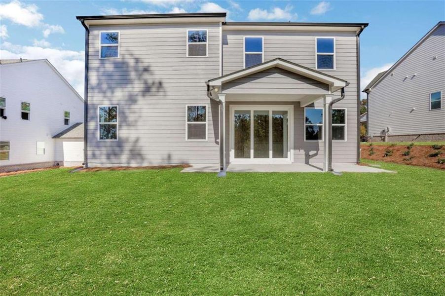 Exterior details and patio area of a home in The Paddocks at Doc Hughes, Buford (Image 4).