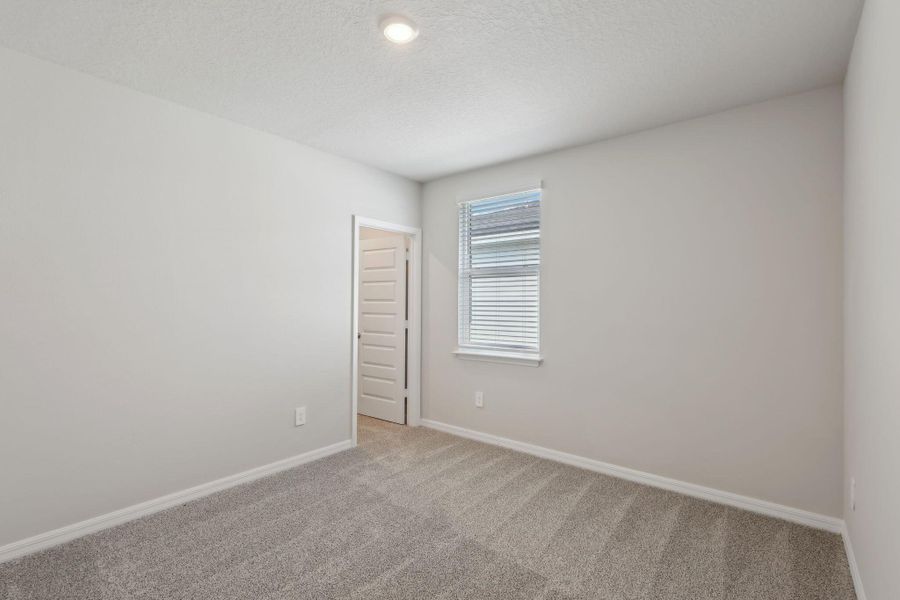 Spacious, unfurnished interior of a new home in Hampton Park - Classic Series, Vero Beach (Image 18).