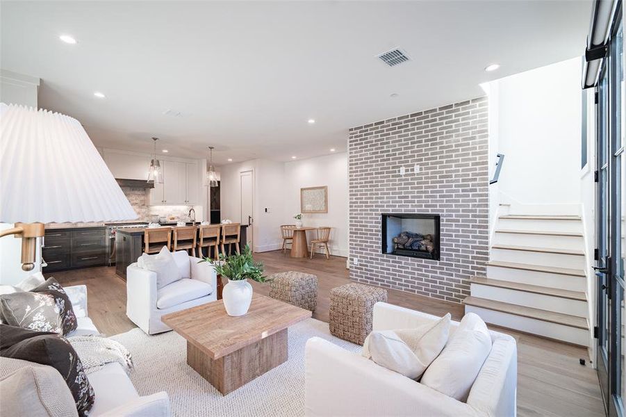 Living room featuring a fireplace and light wood-type flooring