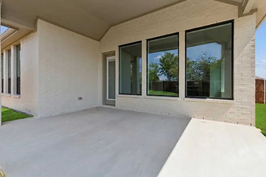 Front exterior of a new home in Parkmont – Timberbrook, Justin, TX, highlighting curb appeal (Image 31). Front exterior of a new home in Parkmont – Timberbrook, Justin, TX, highlighting curb appeal (Image 31).