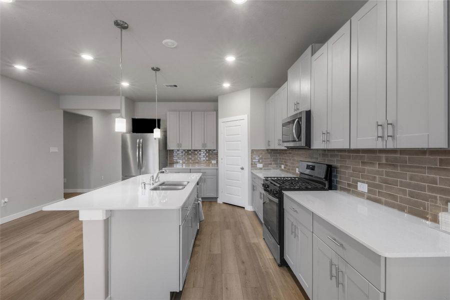 Modern and functional kitchen featuring generous counter space, ample cabinetry, and a practical layout ideal for both daily cooking and hosting guests. The kitchen seamlessly connects to the main living areas for easy interaction.