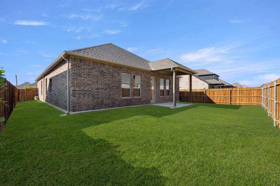 Exterior details and patio area of a home in Country Lakes, Argyle (Image 21).