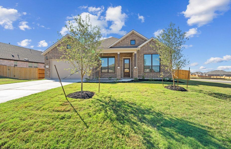 Front exterior of a new home in 6 Creeks, Kyle, TX, highlighting curb appeal (Image 1). Front exterior of a new home in 6 Creeks, Kyle, TX, highlighting curb appeal (Image 1).