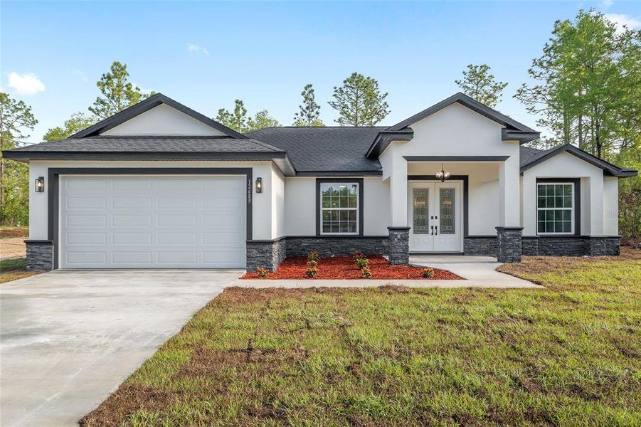 Front exterior of a new home in , Dunnellon, FL, highlighting curb appeal (Image 31).