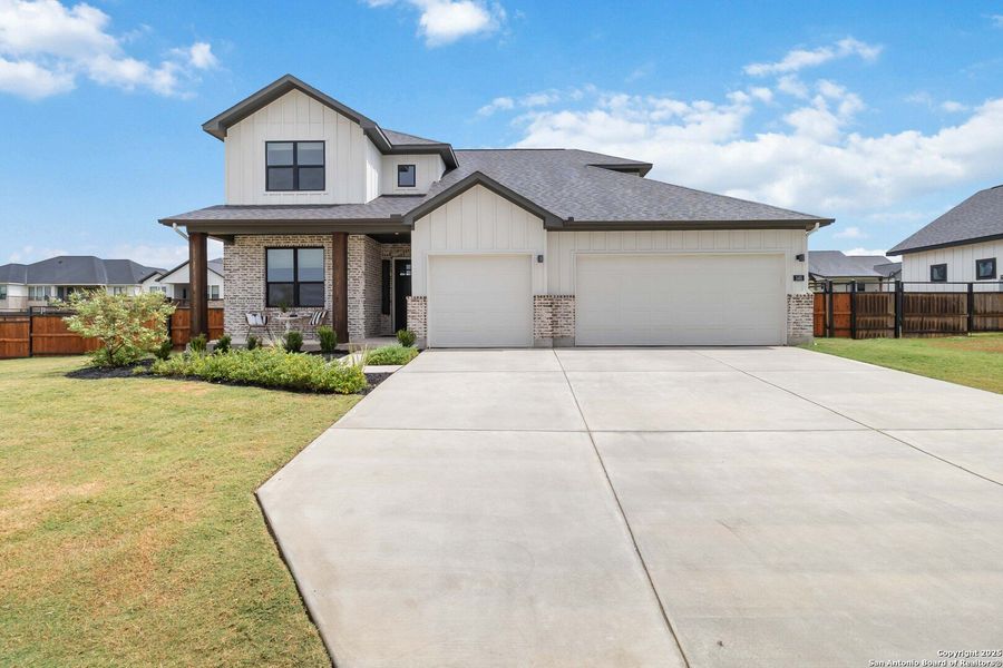 Front exterior of a new home in Woodbridge Farms, La Vernia, TX, highlighting curb appeal (Image 26).