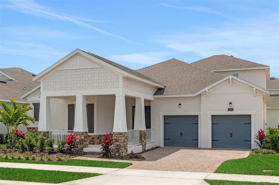 Front exterior of a new home in Avalon Woods, Winter Garden, FL, highlighting curb appeal (Image 25).