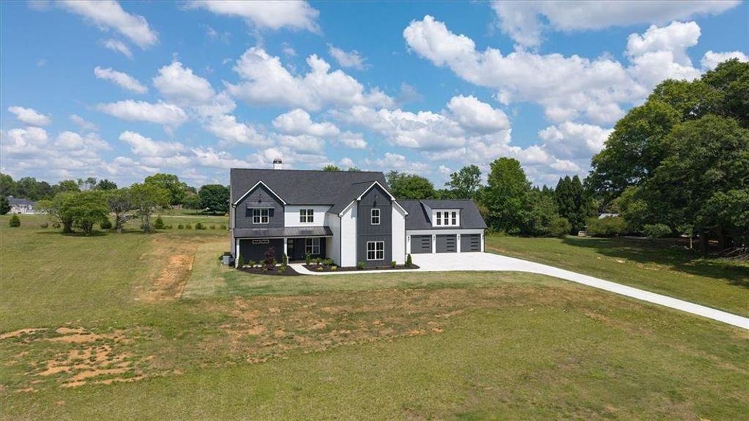 Front exterior of a new home in , Carrollton, GA, highlighting curb appeal (Image 30).
