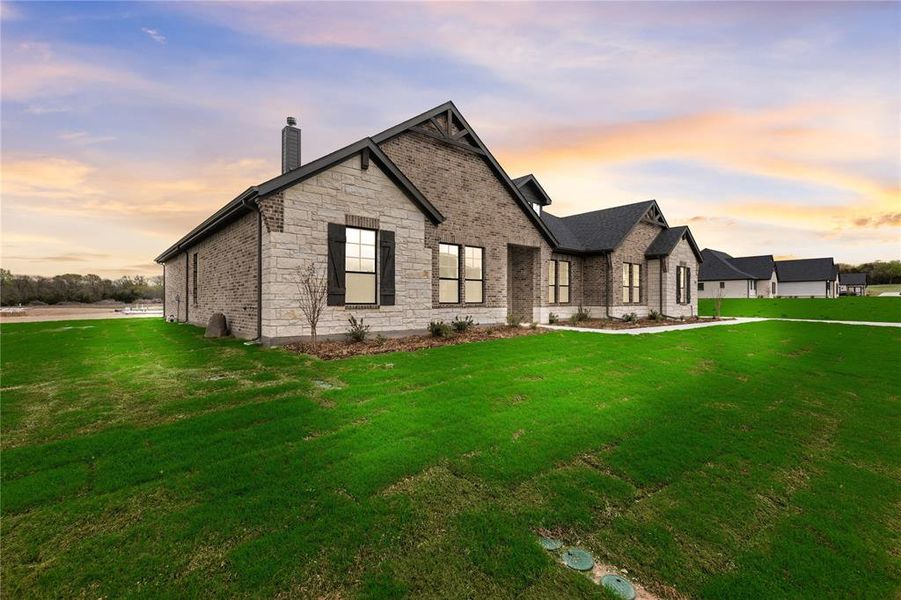 Front exterior of a new home in King Crossing Estates, Van Alstyne, TX, highlighting curb appeal (Image 26).