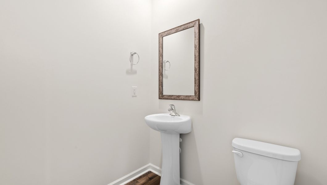 Representative furnished interior of a home built from the WILMINGTON by D.R. Horton in Benjamin's Grove, Woodruff (Image 6).