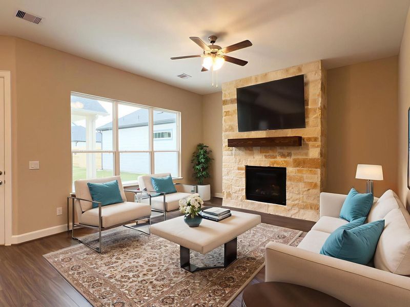 The living room features an expansive, light filled area with large windows and a versatile layout perfect for entertaining and everyday living