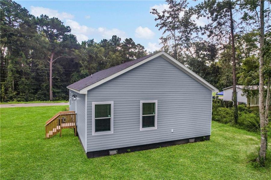Front exterior of a new home in , Ludowici, GA, highlighting curb appeal (Image 21).