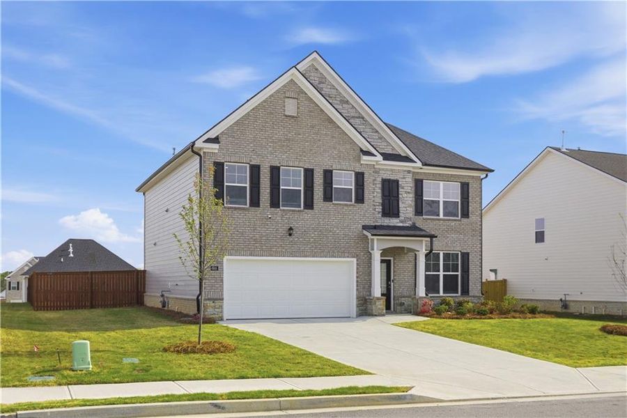 Front exterior of a new home in Independence, Loganville, GA, highlighting curb appeal (Image 28).