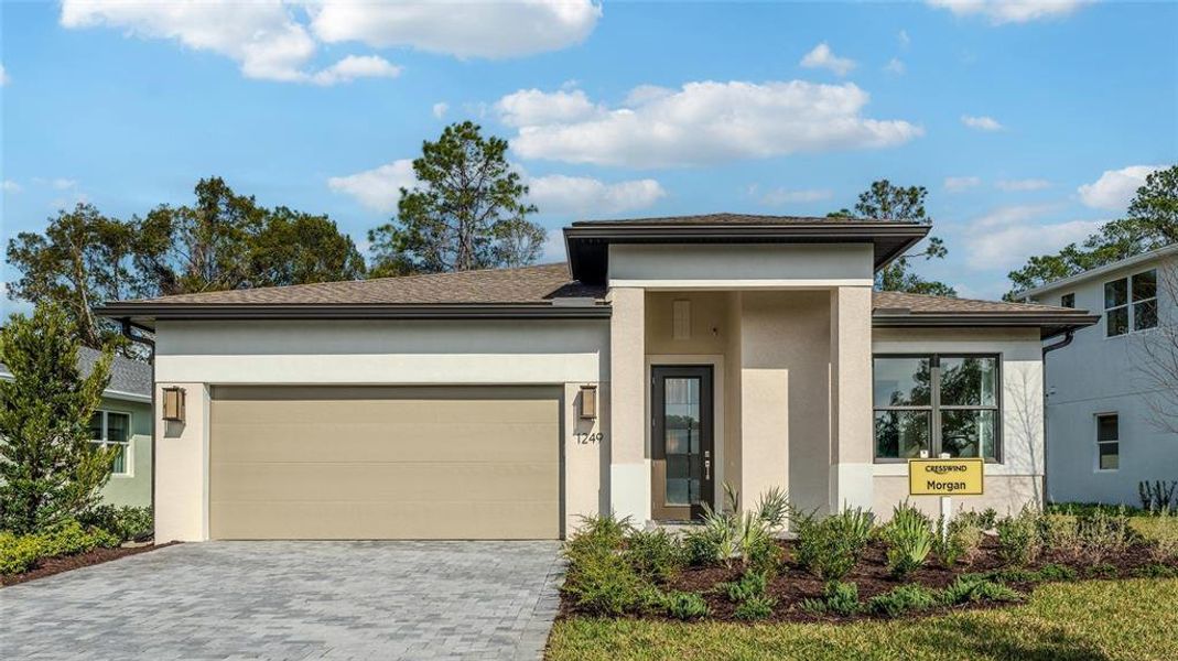 Front exterior of a new home in Cresswind DeLand, Deland, FL, highlighting curb appeal (Image 2). Front exterior of a new home in Cresswind DeLand, Deland, FL, highlighting curb appeal (Image 2).