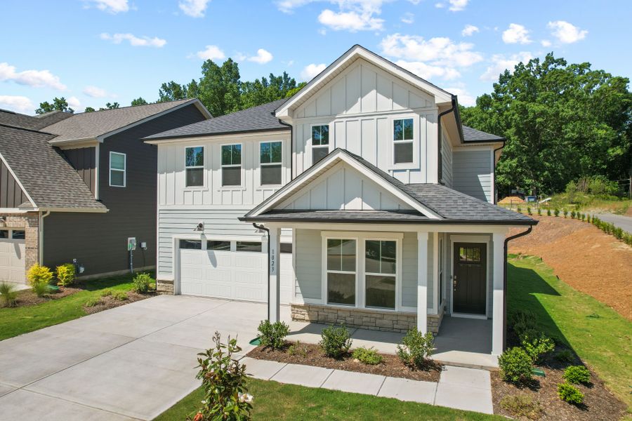 Front exterior of a new home in Elmbrook, Indian Trail, NC, highlighting curb appeal (Image 33). Front exterior of a new home in Elmbrook, Indian Trail, NC, highlighting curb appeal (Image 33).