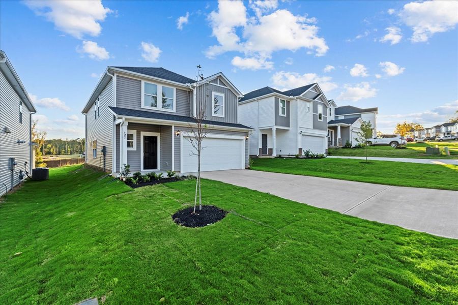 Front exterior of a new home in The Farm at Wells Creek - Heritage Collection, Gray Court, SC, highlighting curb appeal (Image 2). Front exterior of a new home in The Farm at Wells Creek - Heritage Collection, Gray Court, SC, highlighting curb appeal (Image 2).