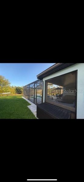 Exterior details and patio area of a home in Isles at BayView, Parrish (Image 21).