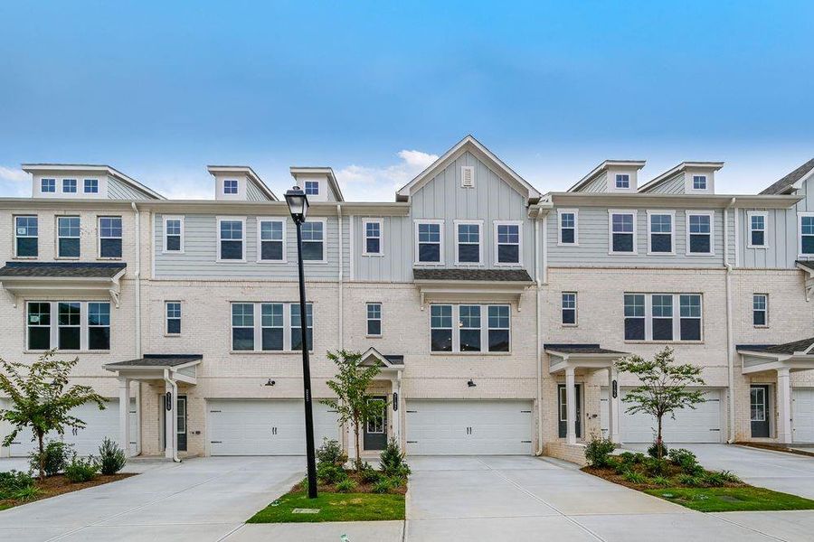 Front exterior of a new home in Auburn Glen Towns, Dacula, GA, highlighting curb appeal (Image 2).