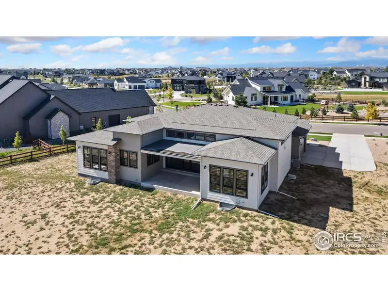 Front exterior of a new home in Acadia at RainDance, Windsor, CO, highlighting curb appeal (Image 1).
