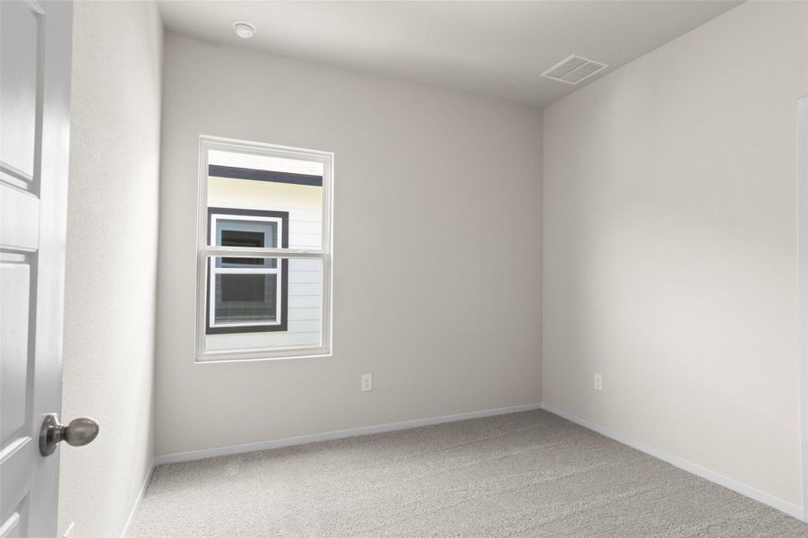 Empty room featuring carpet and baseboards Empty room featuring carpet and baseboards