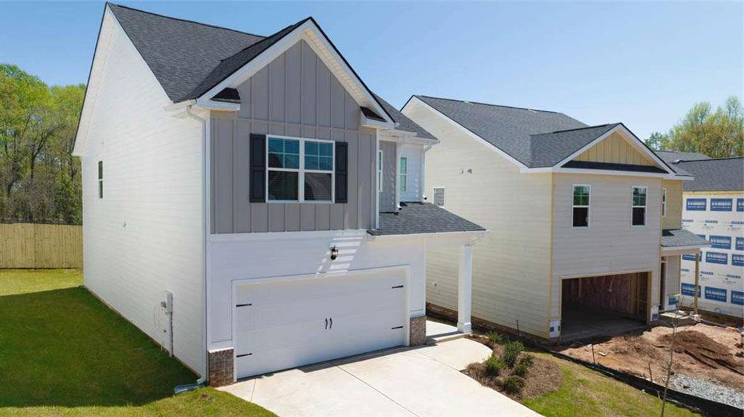 Front exterior of a new home in Shoal Creek, Hampton, GA, highlighting curb appeal (Image 2).