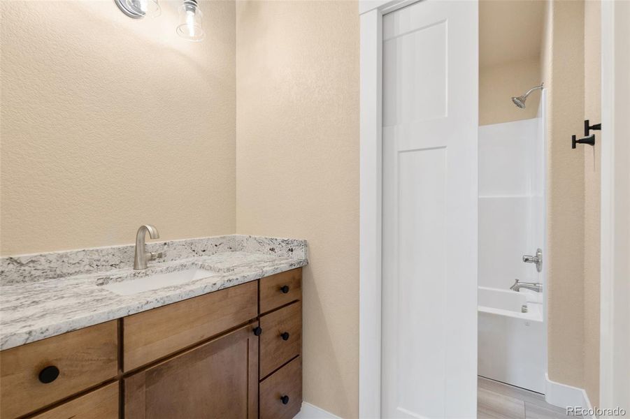 Pocket door between the sink/vanity and the shower/tub/toilet Pocket door between the sink/vanity and the shower/tub/toilet