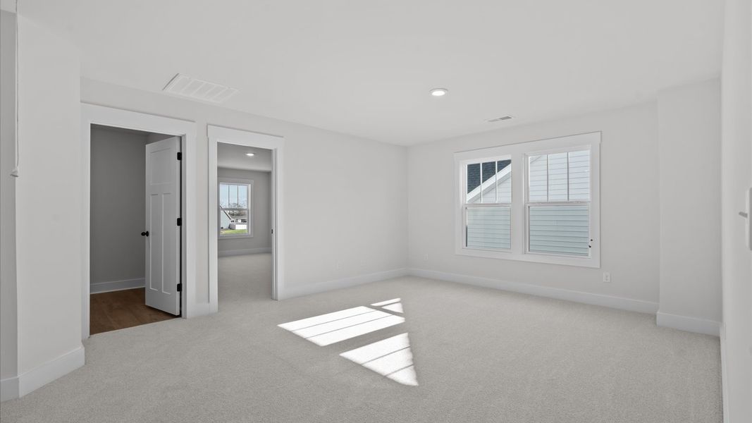 Refined loft with comfortable carpeted flooring and tasteful design throughout Refined loft with comfortable carpeted flooring and tasteful design throughout