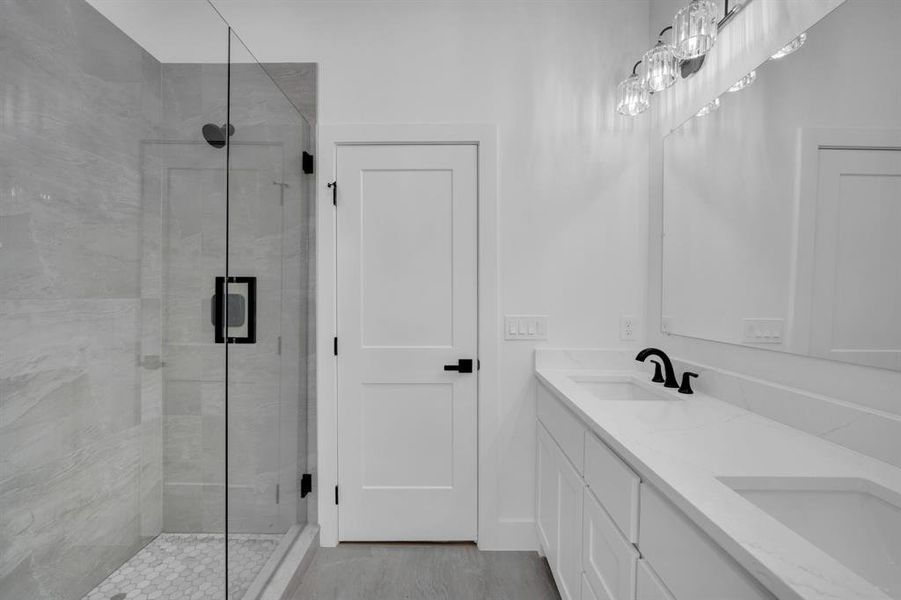 Bathroom with walk in shower and dual bowl vanity