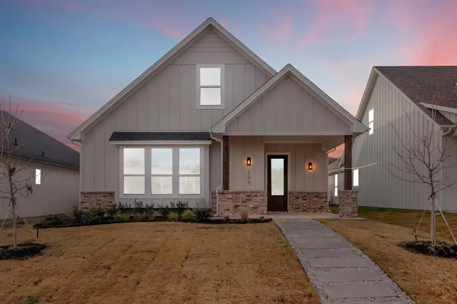 Front exterior of a new home in , Justin, TX, highlighting curb appeal (Image 2). Front exterior of a new home in , Justin, TX, highlighting curb appeal (Image 2).