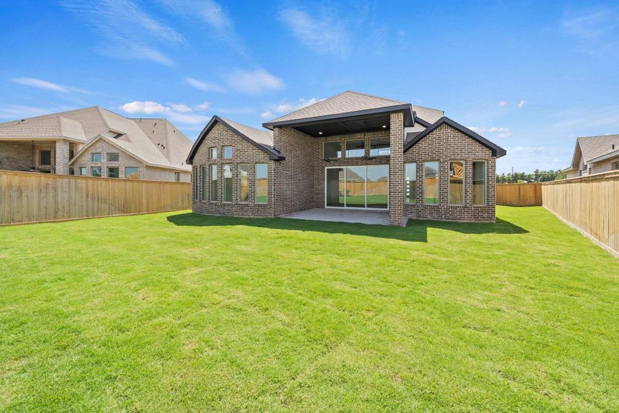 Exterior details and patio area of a home in Bridgeland, Cypress (Image 17).