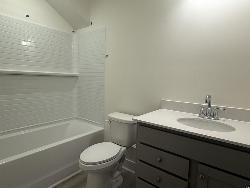 Full bath with vanity and shower / bath combination