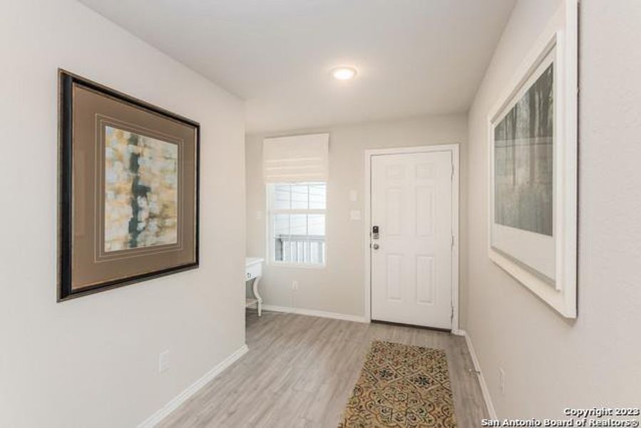 Entrance foyer featuring light wood-style floors and recessed lighting Entrance foyer featuring light wood-style floors and recessed lighting