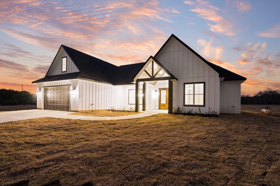 Front exterior of a new home in , New Waverly, TX, highlighting curb appeal (Image 26).
