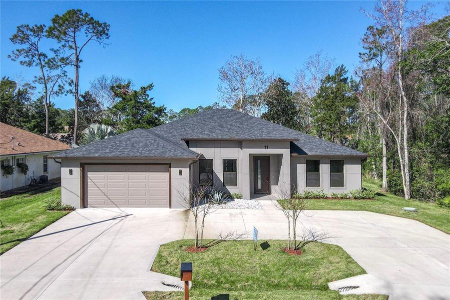 Front exterior of a new home in , Palm Coast, FL, highlighting curb appeal (Image 2).
