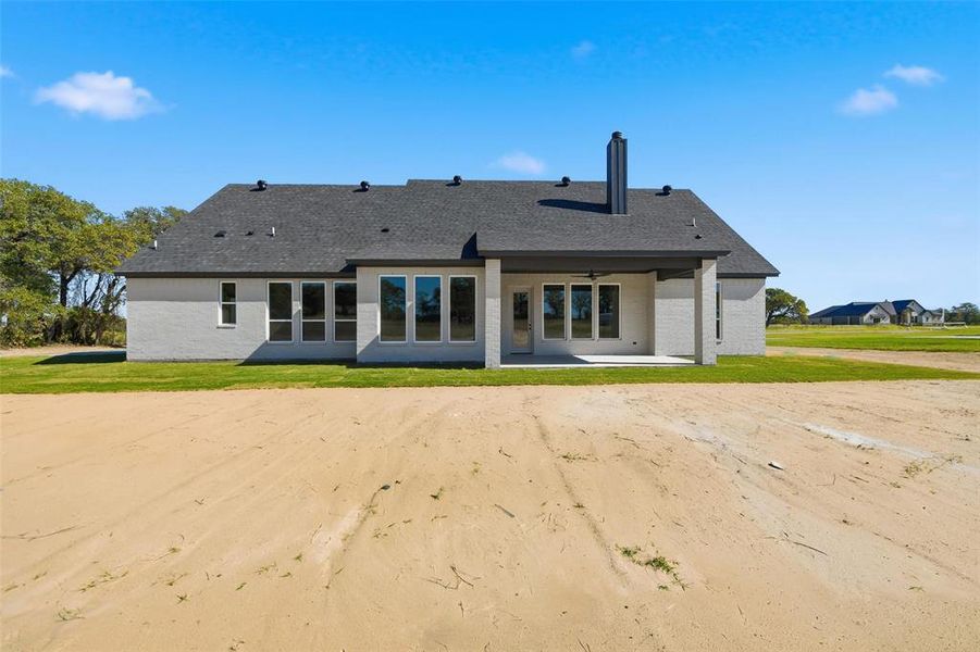 Front exterior of a new home in , Poolville, TX, highlighting curb appeal (Image 2).