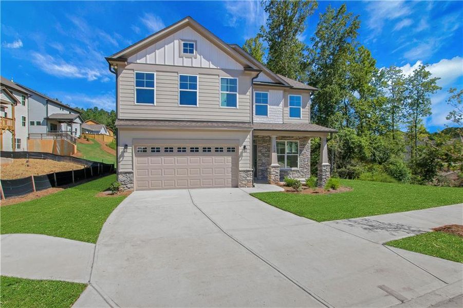 Front exterior of a new home in Marble Tree, Ball Ground, GA, highlighting curb appeal (Image 1).