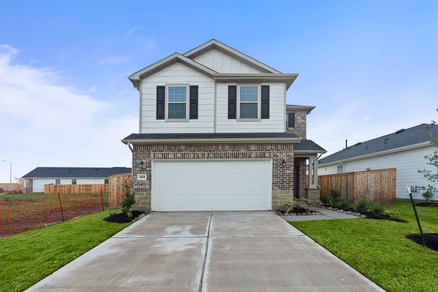 Front exterior of a new home in Crosby Farms, Crosby, TX, highlighting curb appeal (Image 1). Front exterior of a new home in Crosby Farms, Crosby, TX, highlighting curb appeal (Image 1).