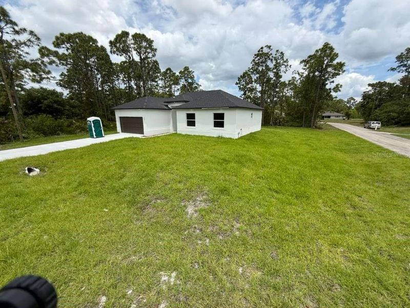 Exterior details and patio area of a home in , Lehigh Acres (Image 22). Exterior details and patio area of a home in , Lehigh Acres (Image 22).