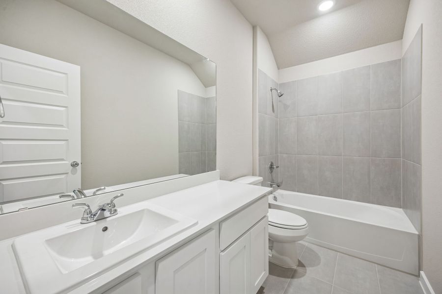 Bathroom in the Wimbledon home plan by Trophy Signature Homes – REPRESENTATIVE PHOTO
