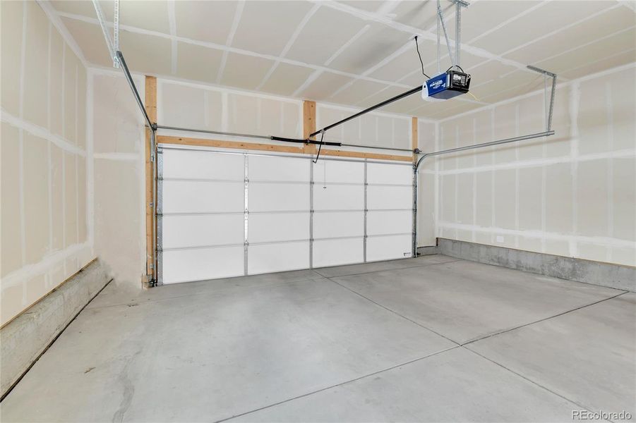 2 Car Garage - Overhead Storage and Refrigerator Included