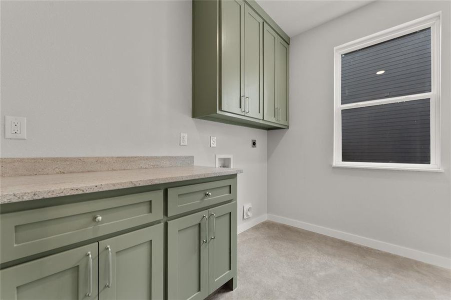 Laundry room with cabinet space, light colored carpet, electric dryer hookup, and washer hookup Laundry room with cabinet space, light colored carpet, electric dryer hookup, and washer hookup