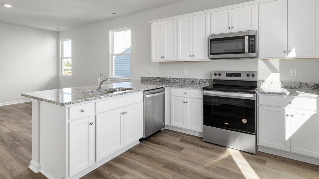 Representative furnished interior of a home built from the PERRY by D.R. Horton in The Cottages at Blake Farm, Wilmington (Image 10).