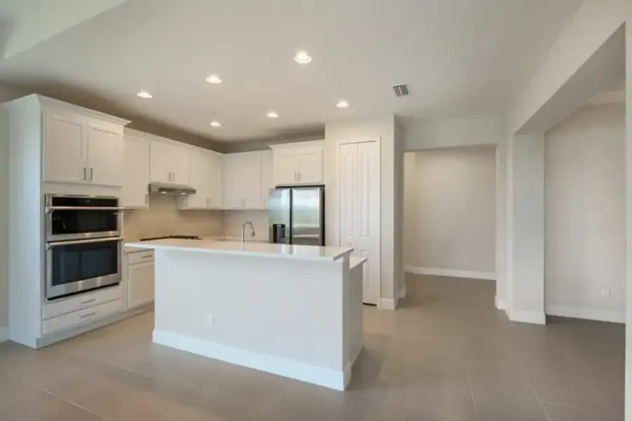 Representative furnished interior of a home built from the Boca Grande by Medallion Home in Reflection Villas at Watercolor Place, Bradenton (Image 7).